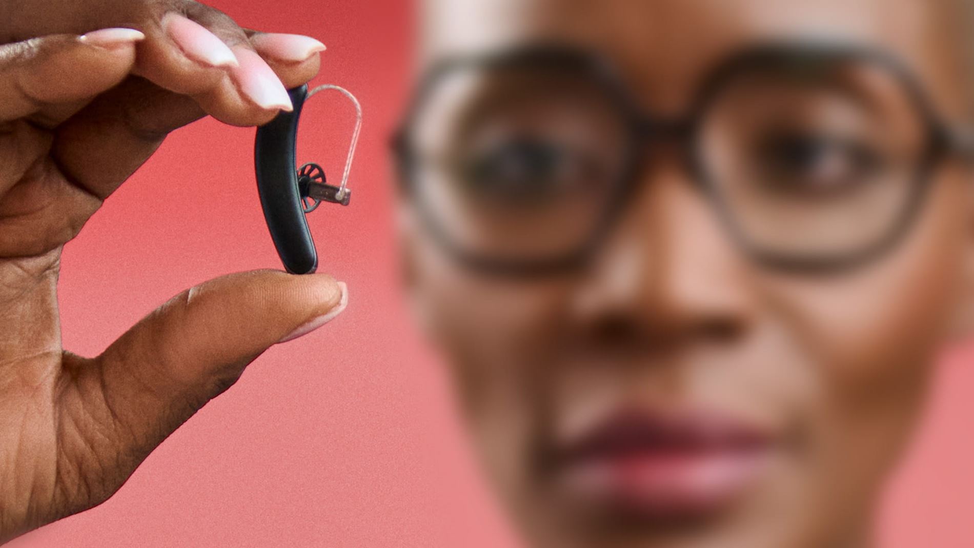 Person holding ear